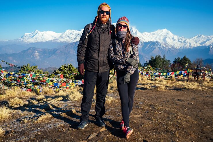 beautiful-active-woman-man-are-hugging-against-background-mountains-concept-active-recreation-tourism-mountains-couple-love-trekking-nepal-himalayas_175356-498